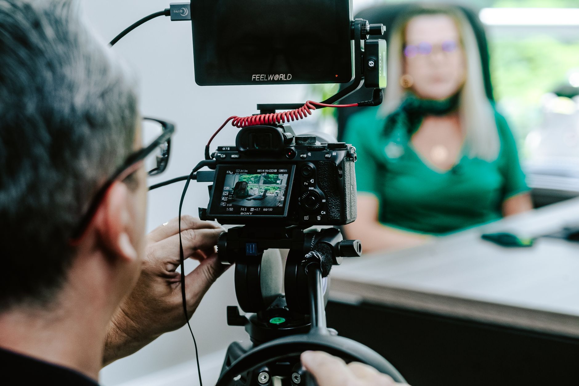 Horizon video production studio team filming inside an interview room